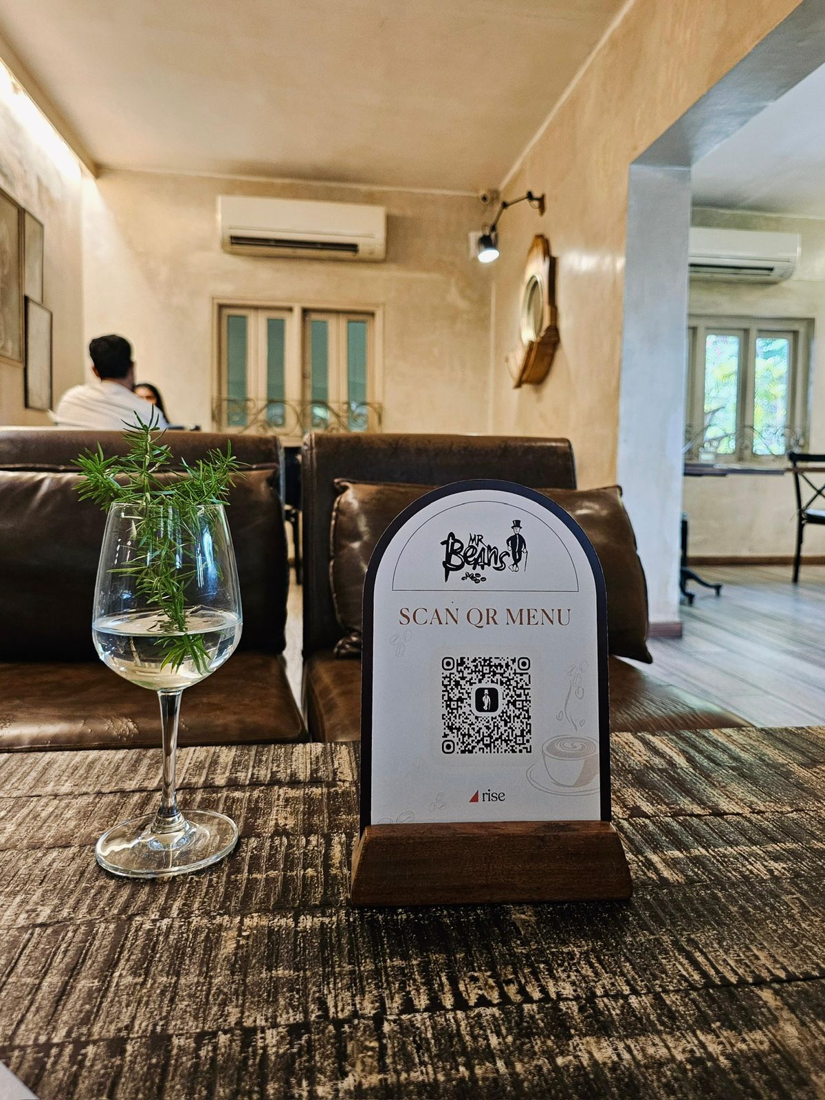 QR menu stand on a table at Mr Beans cafe