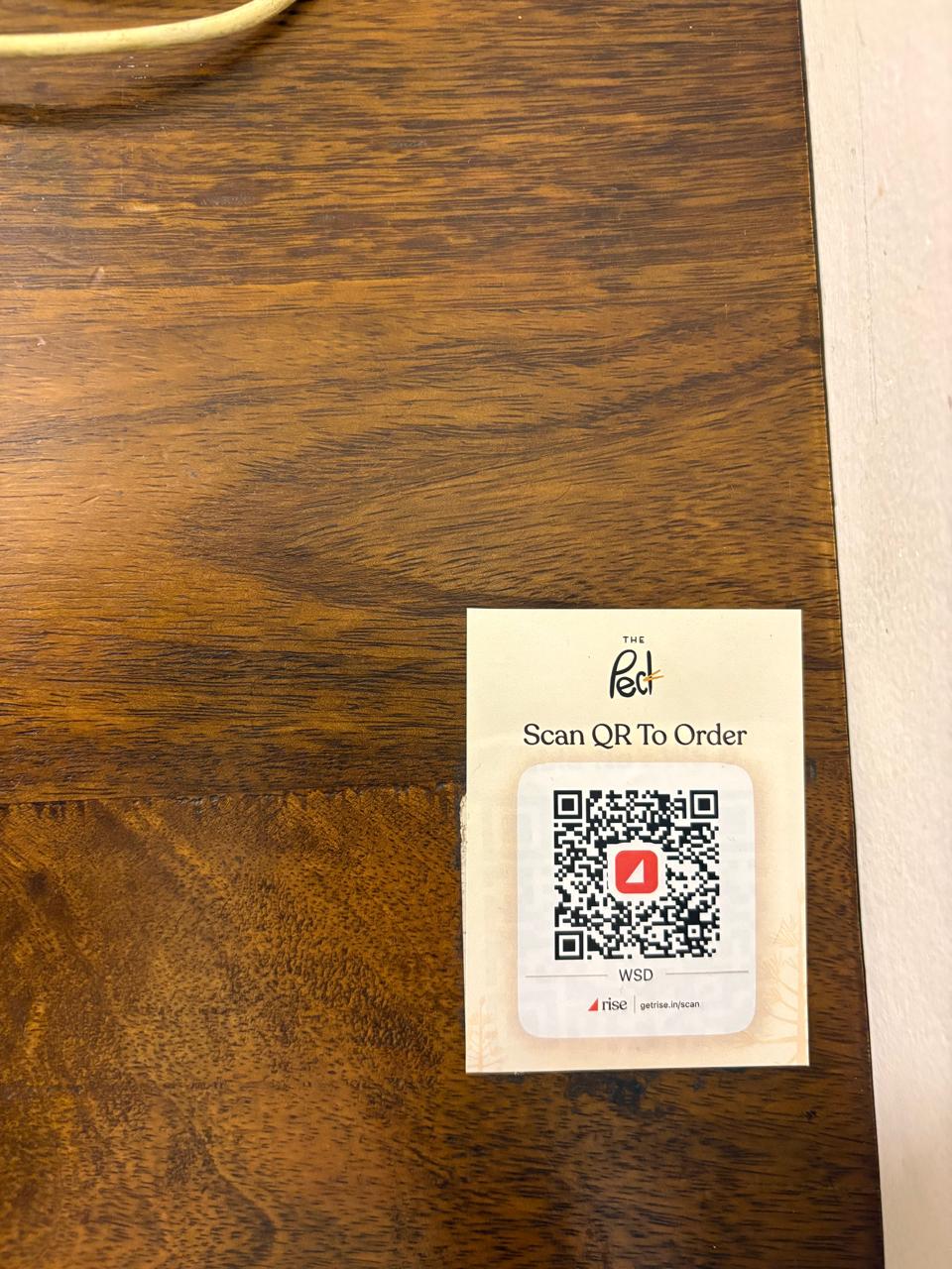 Scan-to-order QR code on a table at The Peck